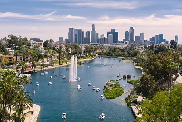 A view of the city from above, with boats in the water.