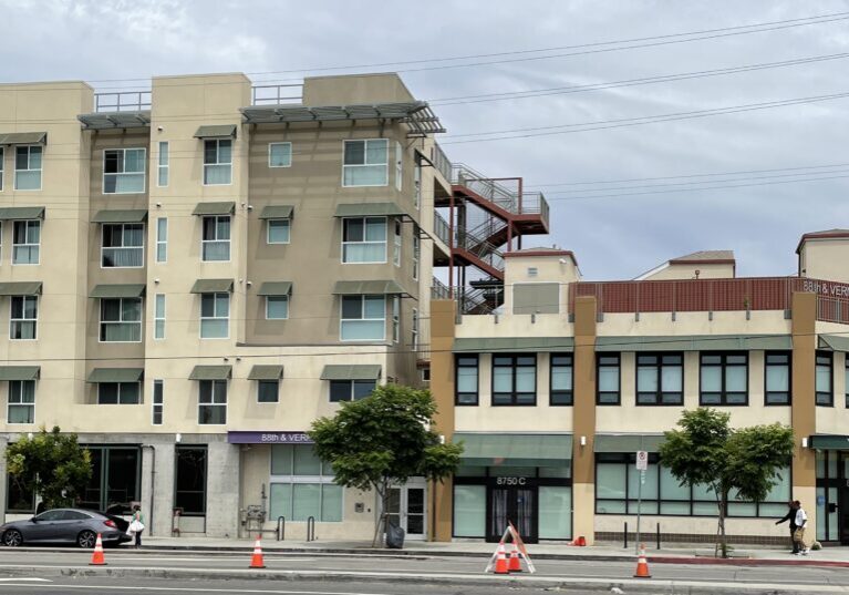 A building with orange cones on the side of it.